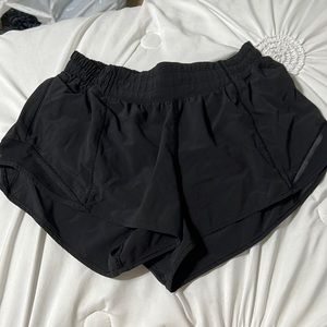 Black low waisted lululemon hotty hot shorts (size 6)